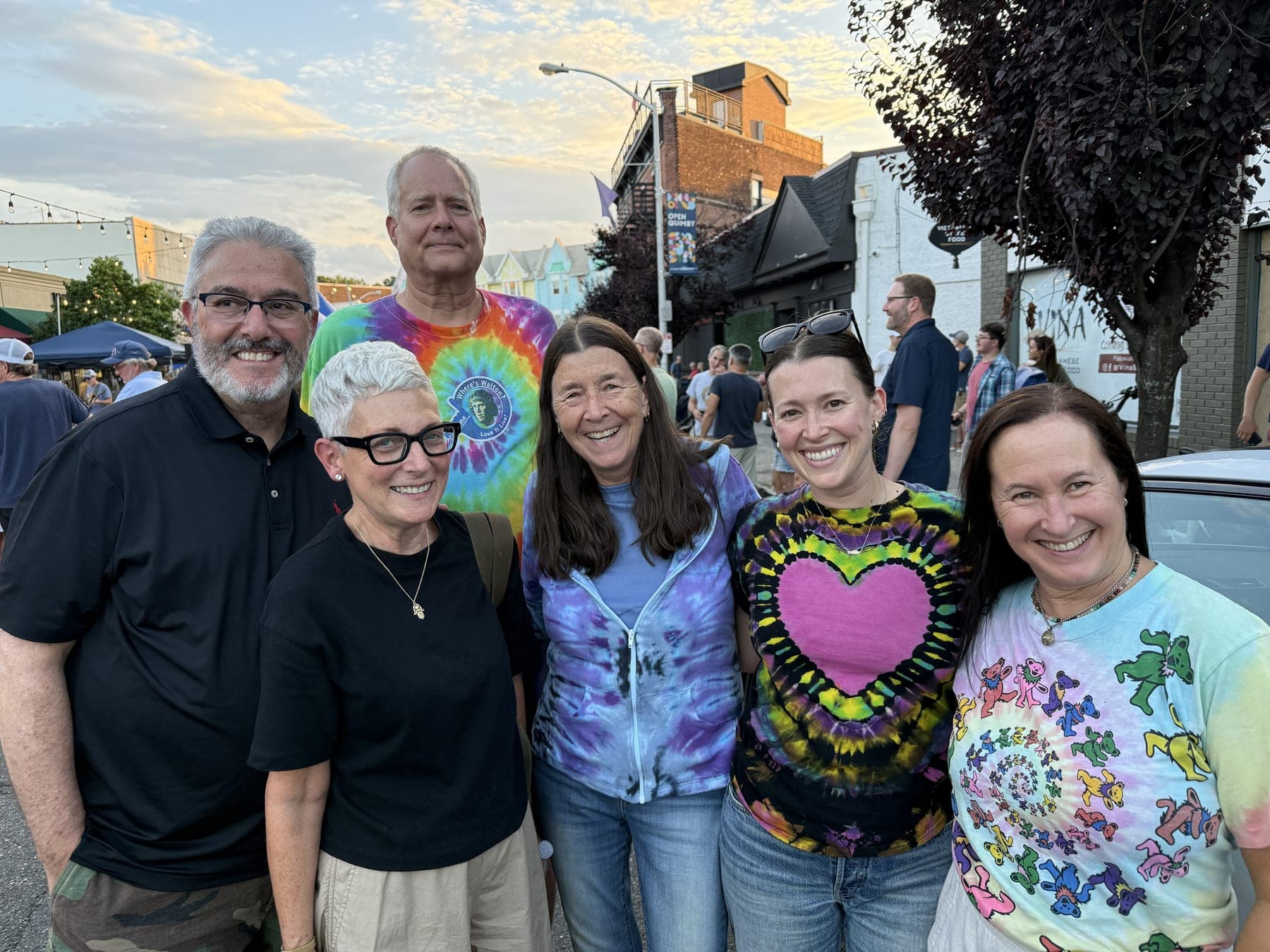 Neighbors in tie-dye gather for the final summer-style community night before Labor Day.