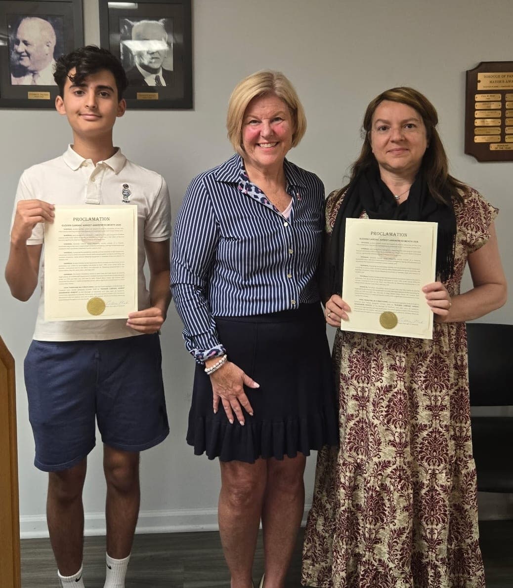 The Aliver Foundation’s Teen Ambassador Sebastiao Pinto and First Responder Committee Member Luciane Raibin join Mayor Colleen Mahr with the Sudden Cardiac Arrest Awareness Month proclamation.