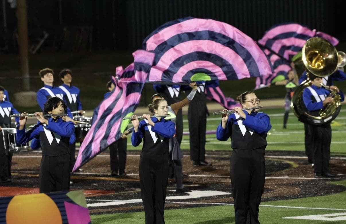 Flutes and color guard flags in the Marching Blue Devils’ “In Shape.”